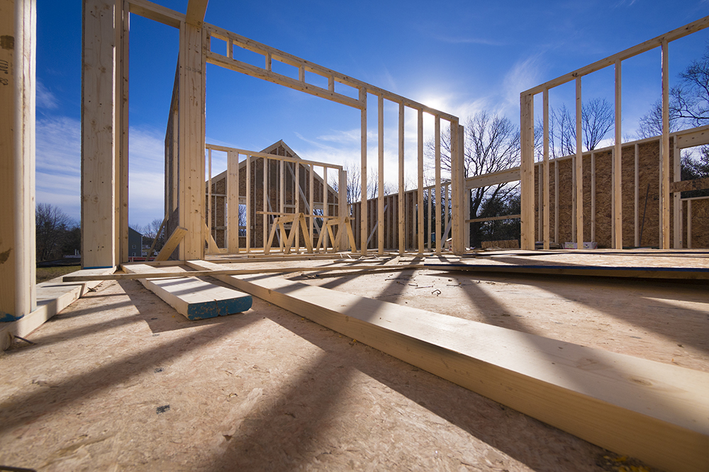 Wooden beams of a house being constructed seen while providing home inspection services