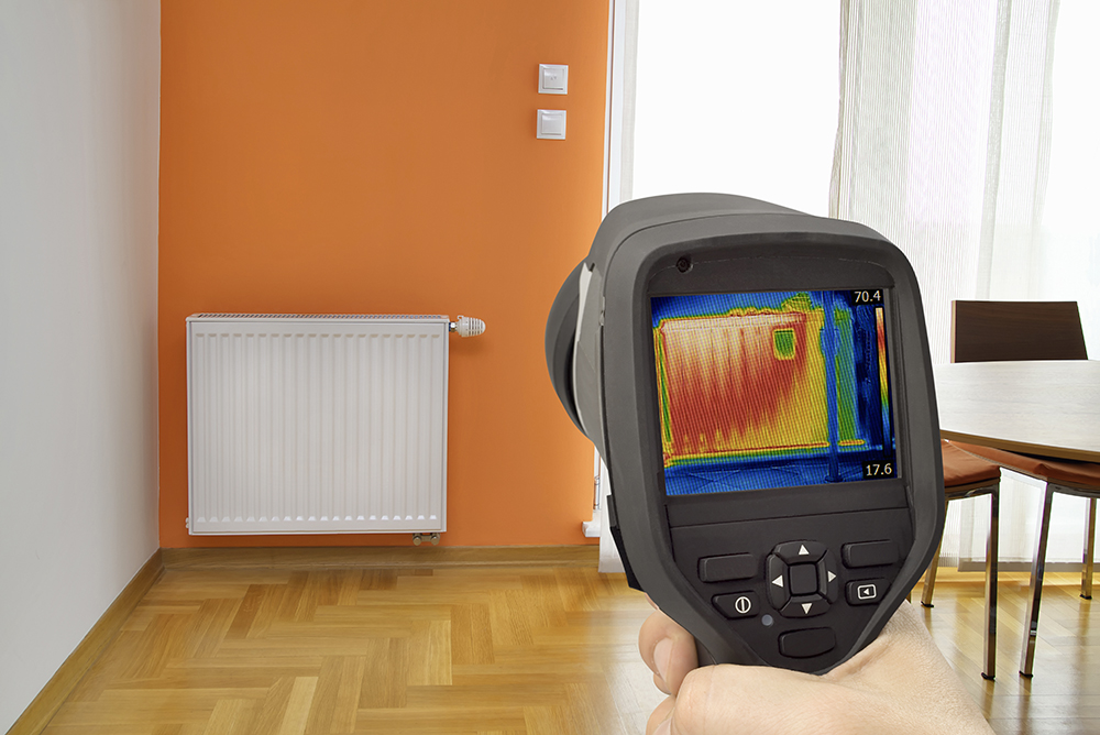 Thermal imaging camera pointed at a radiator by one of our home inspectors